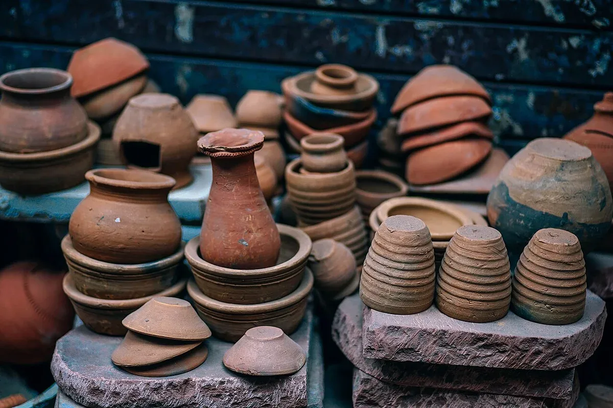 A collection of handmade terracotta pots and bowls