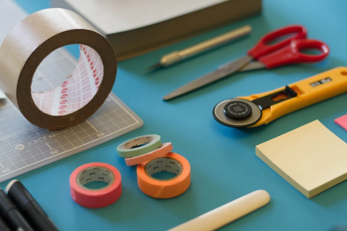 Scissors, tape and craft tools on a table