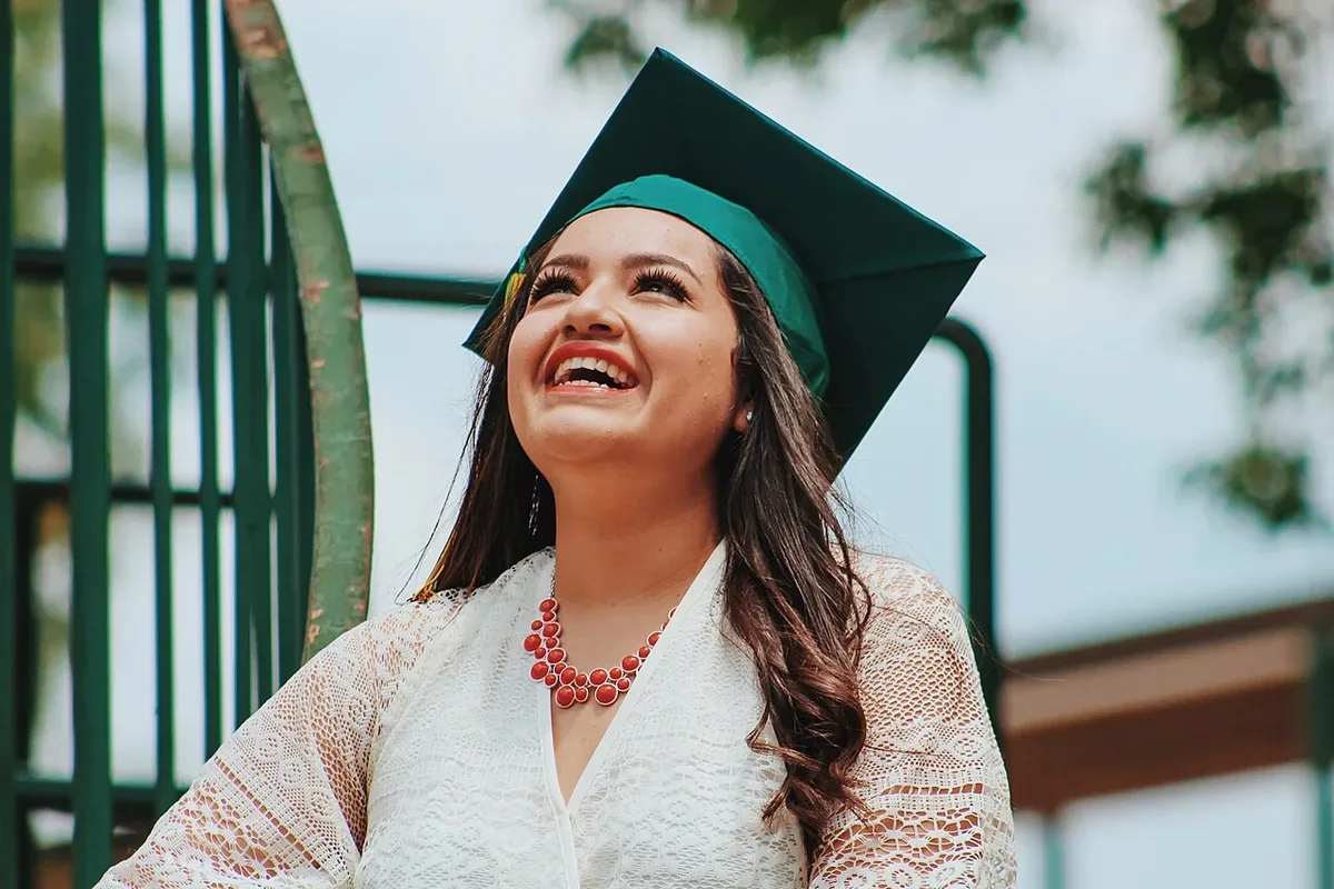 A graduate wearing a graduation cap