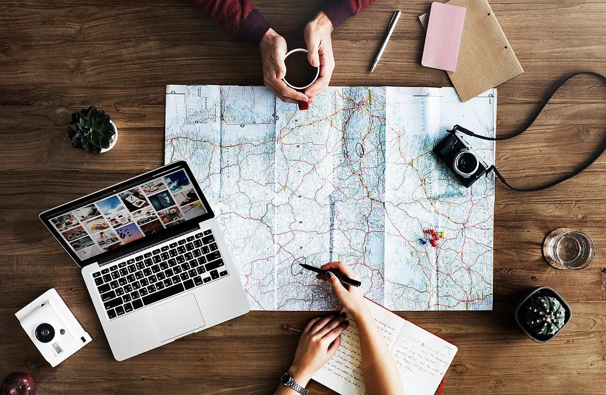 People planning a journey with a map