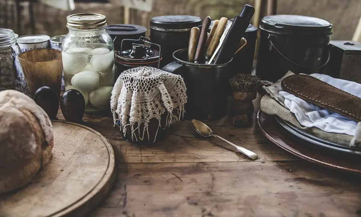 Bread and kitchenware on a rustic kitchen table