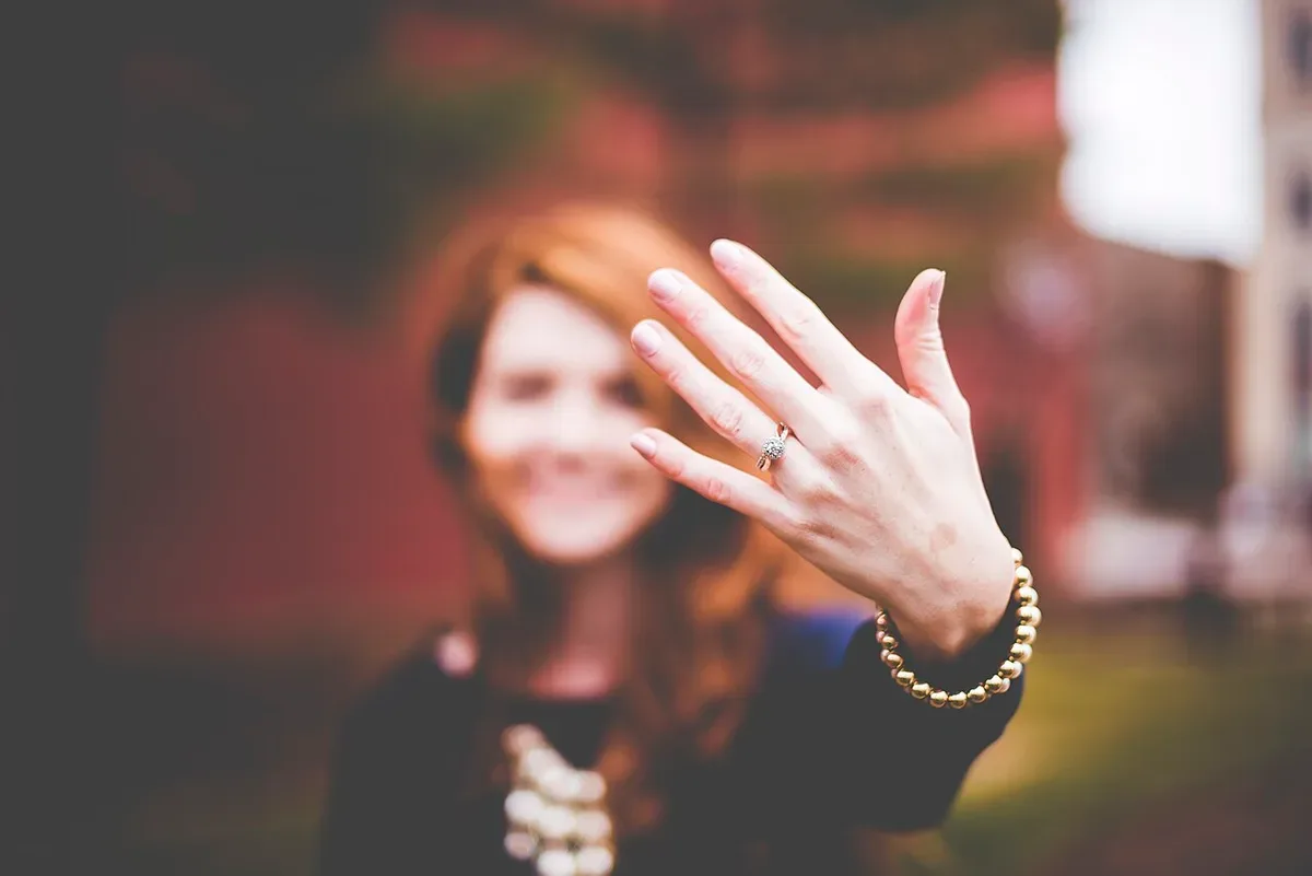 An engagement ring on a hand