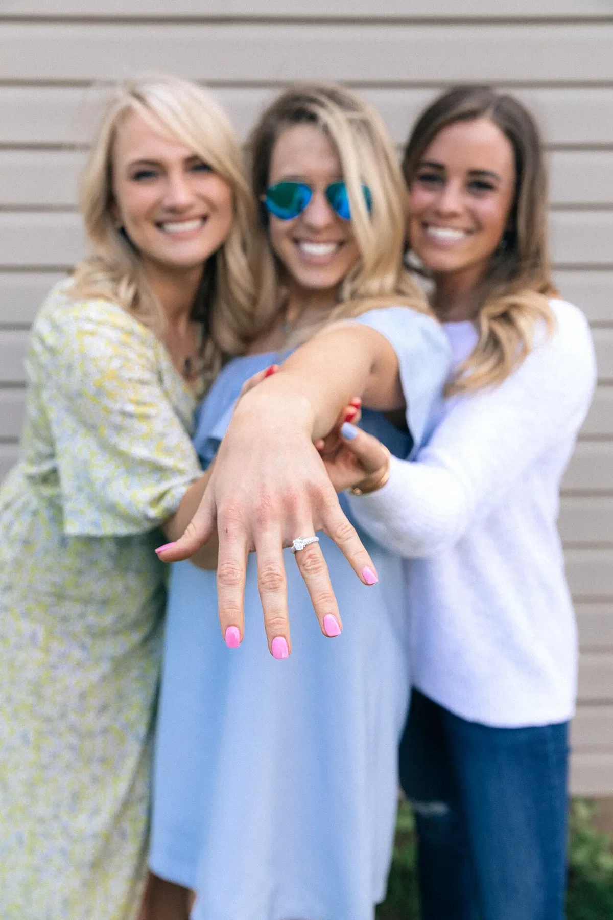 An engagement ring on a hand